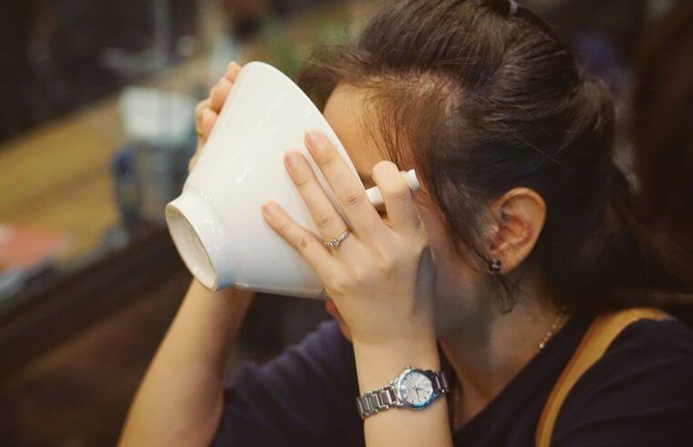 Drinking Soup From A Bowl In Japan