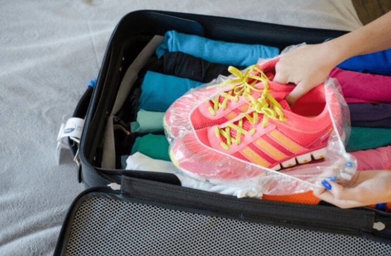 Use a Shower Cap Packer to Keep Dirt off Your Clothes